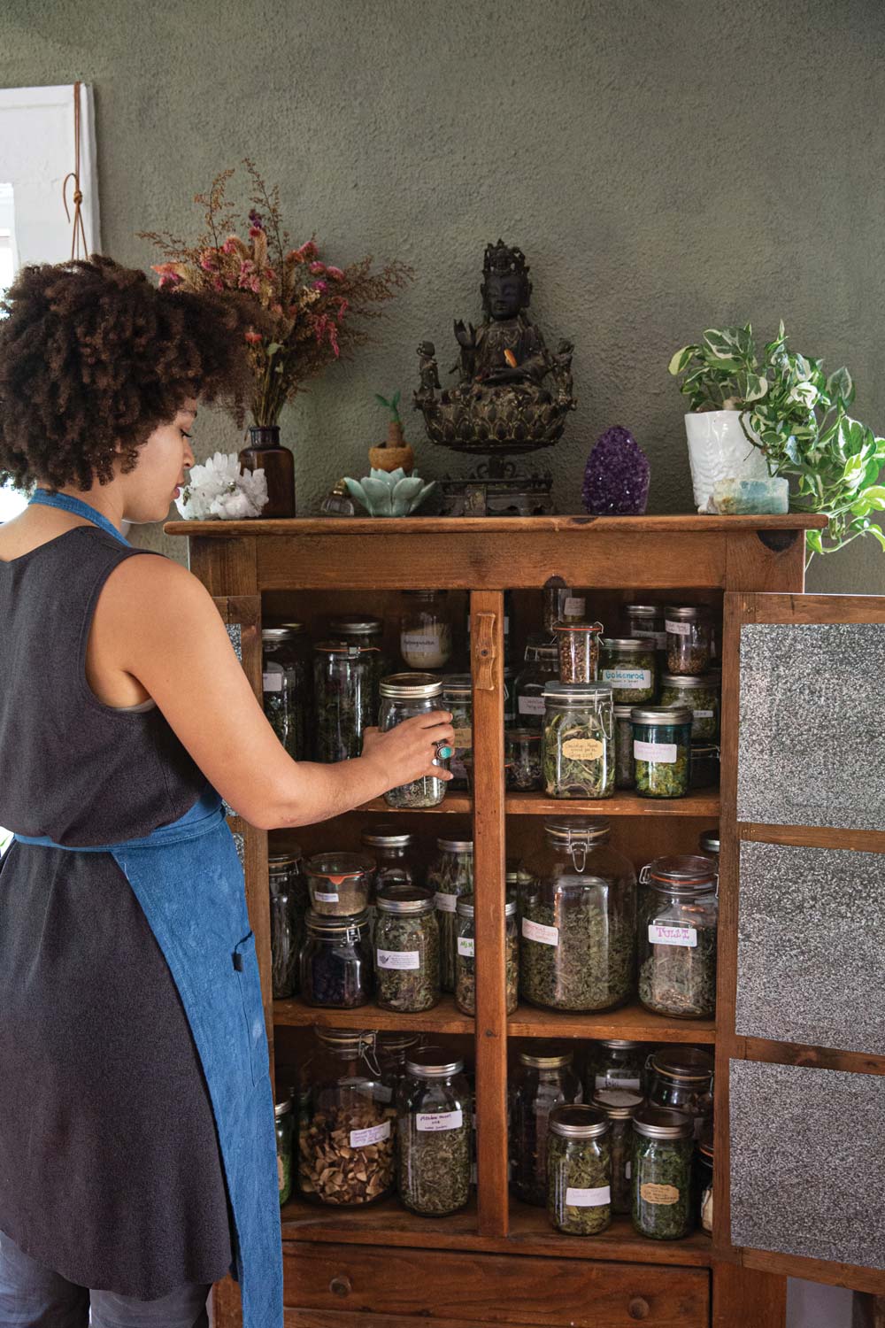 Storing dried herbs in a dark cabinet extends their shelf life.
